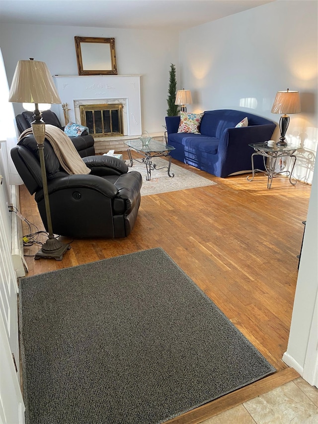 433 Browns Rd, Nesconset, NY 11767 - living room with wood finished floors and a fireplace
