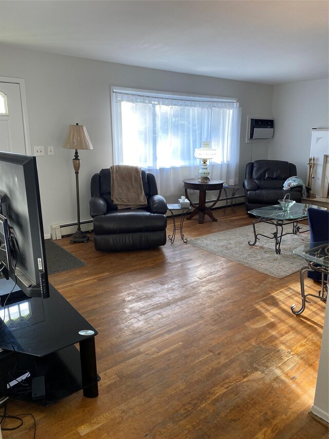 433 Browns Rd, Nesconset, NY 11767 - living room with a baseboard radiator, hardwood / wood-style flooring, and a wall mounted AC