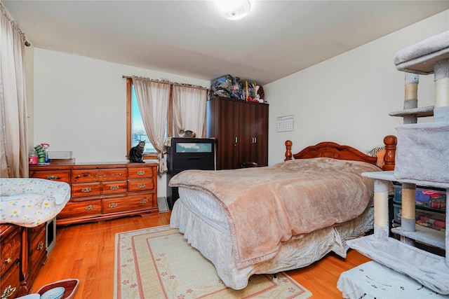 bedroom featuring wood finished floors