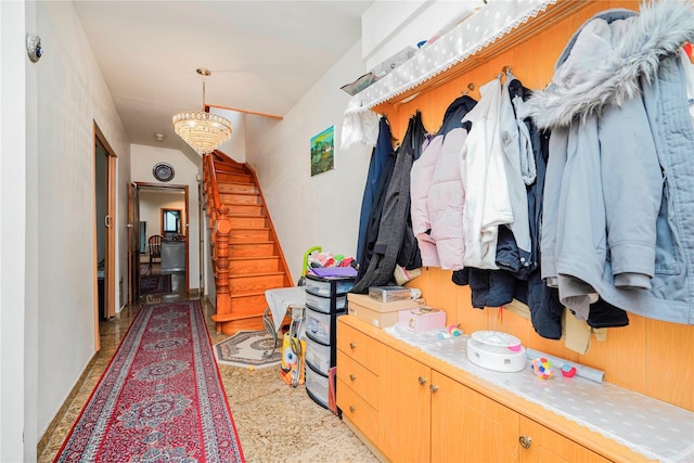 mudroom with an inviting chandelier