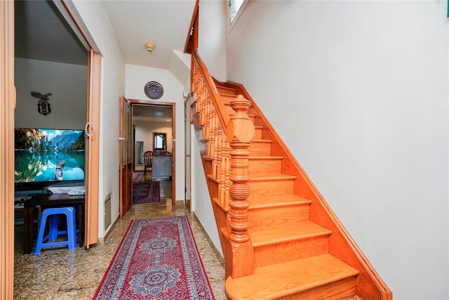 stairway featuring visible vents