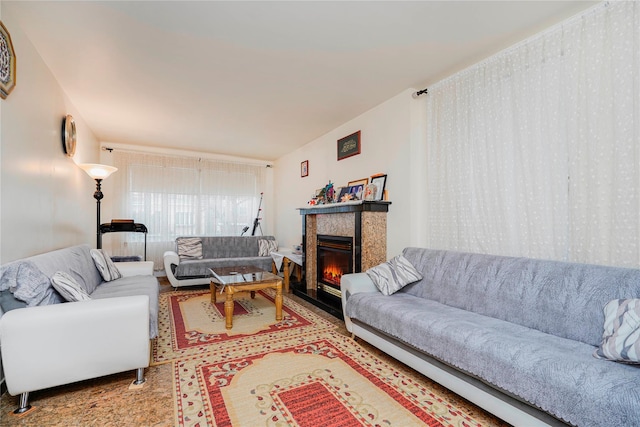 living room featuring wood finished floors and a tile fireplace