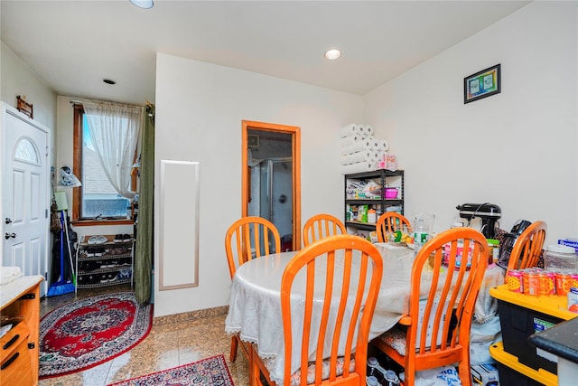 dining room with recessed lighting