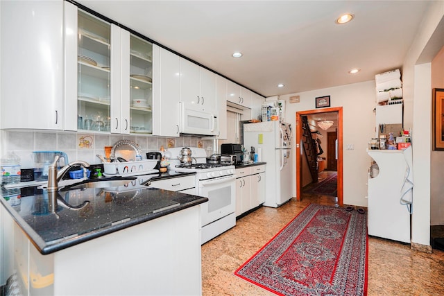 kitchen featuring tasteful backsplash, white cabinetry, recessed lighting, white appliances, and glass insert cabinets