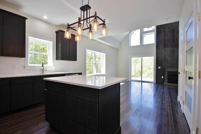1211 Gulf Rd, Livingston Manor, NY 12724 - kitchen featuring healthy amount of natural light, light countertops, a center island, dark wood finished floors, and lofted ceiling