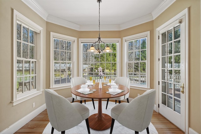 sunroom featuring a chandelier
