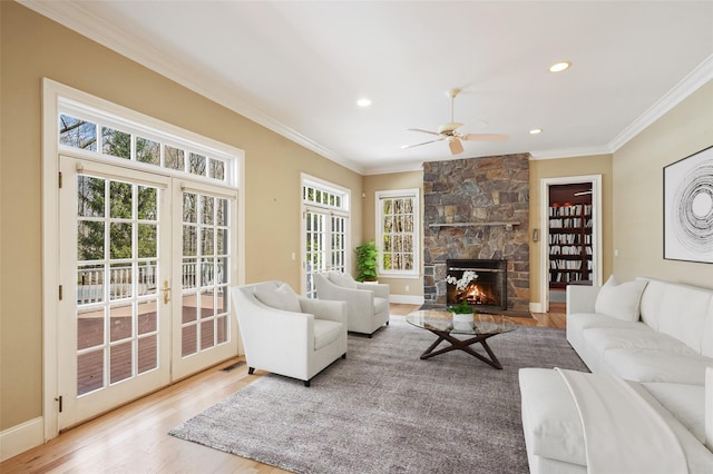 living area with ceiling fan, ornamental molding, recessed lighting, and wood finished floors