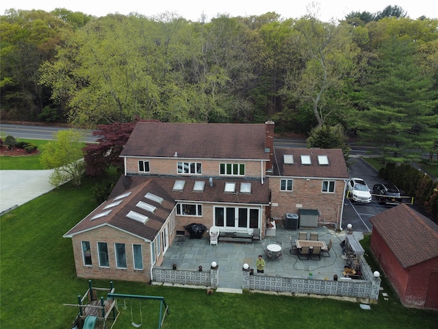 birds eye view of property with a wooded view