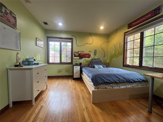 bedroom featuring visible vents, recessed lighting, light wood-style floors, and baseboards