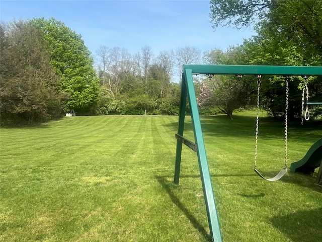 view of jungle gym with a lawn