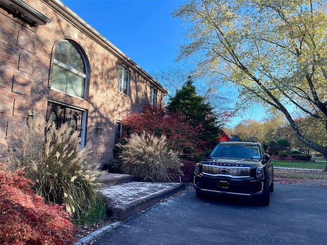 view of home's exterior featuring brick siding