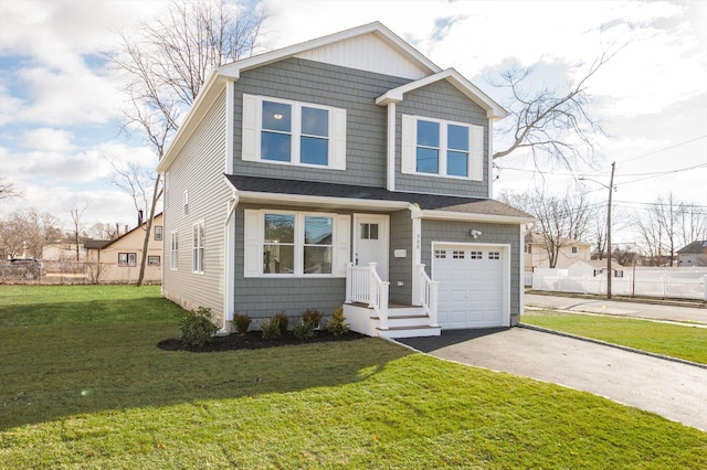 98 S 36th St, Wyandanch, NY 11798 - view of front of property featuring aphalt driveway, fence, a garage, and a front yard