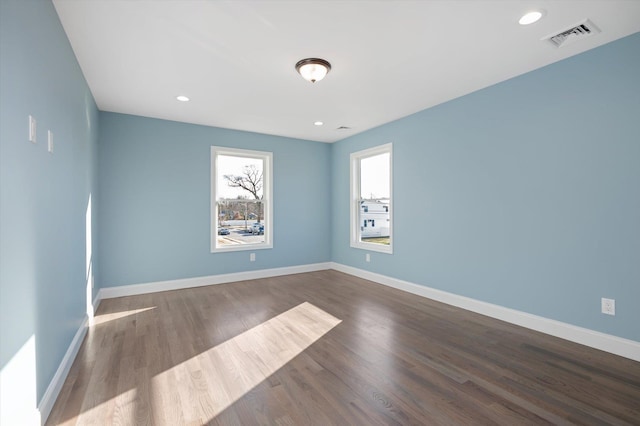 98 S 36th St, Wyandanch, NY 11798 - unfurnished room featuring visible vents, recessed lighting, wood finished floors, and baseboards