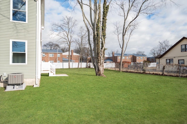 98 S 36th St, Wyandanch, NY 11798 - view of yard with a residential view, central AC, and fence