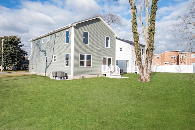 98 S 36th St, Wyandanch, NY 11798 - rear view of house with central air condition unit, a lawn, and fence