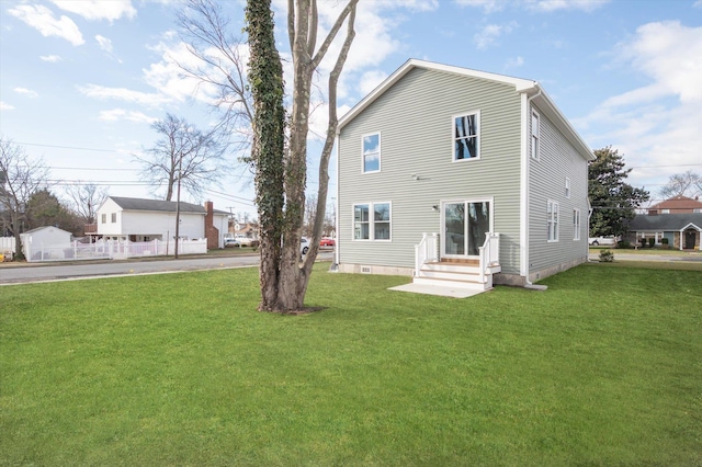 98 S 36th St, Wyandanch, NY 11798 - rear view of house featuring a lawn
