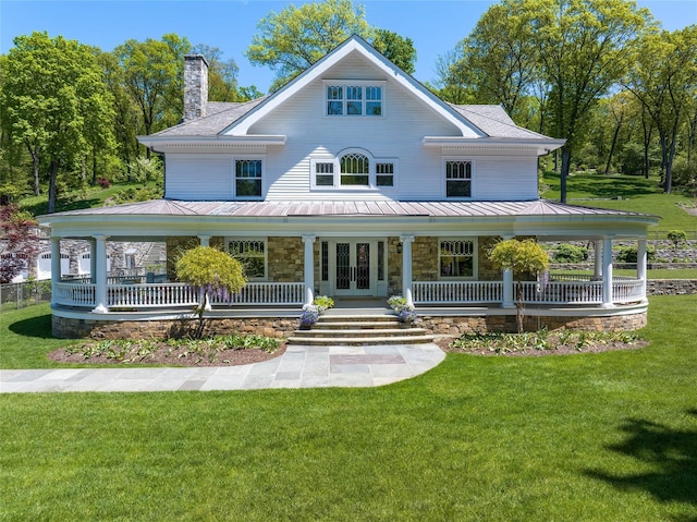 402 Sarles St, Bedford Corners, NY 10549 - farmhouse-style home featuring a porch, a standing seam roof, a front yard, and metal roof