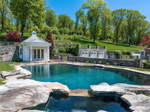 402 Sarles St, Bedford Corners, NY 10549 - view of pool with a storage structure, an outbuilding, fence, french doors, and a patio