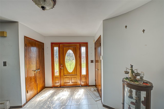 entryway featuring baseboards and baseboard heating