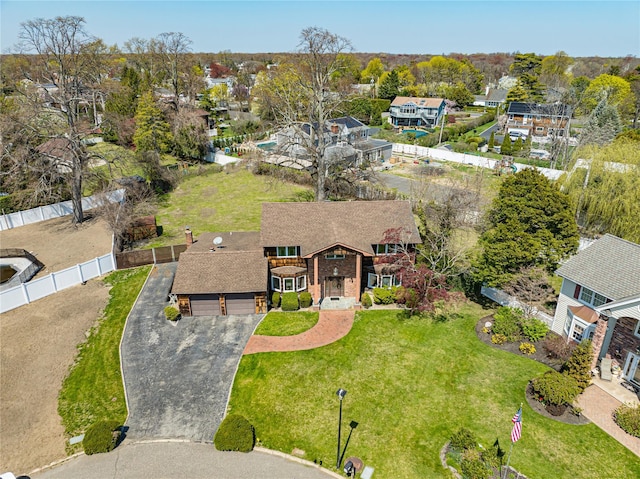 birds eye view of property with a residential view