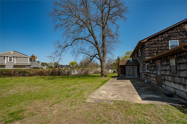 view of yard with a patio and fence