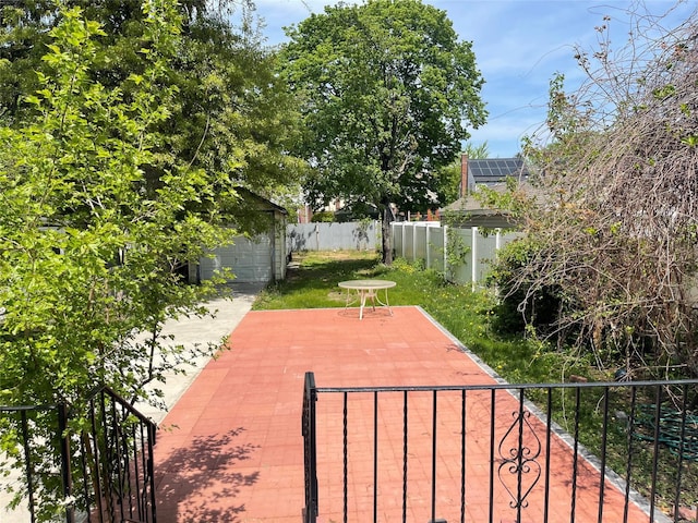 248-29 88th Rd, Bellerose, NY 11426 - view of patio / terrace featuring an outdoor structure and fence private yard