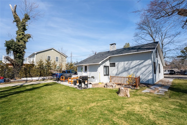 1760 Manatuck Blvd, Bay Shore, NY 11706 - rear view of house featuring a lawn, a chimney, and roof with shingles