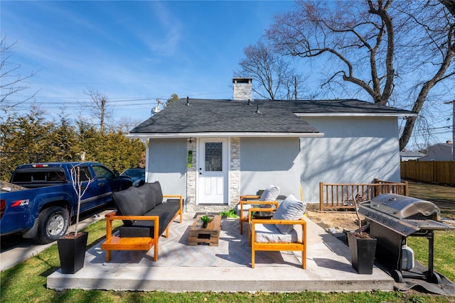 1760 Manatuck Blvd, Bay Shore, NY 11706 - rear view of property with a shingled roof, stucco siding, outdoor lounge area, a chimney, and a patio