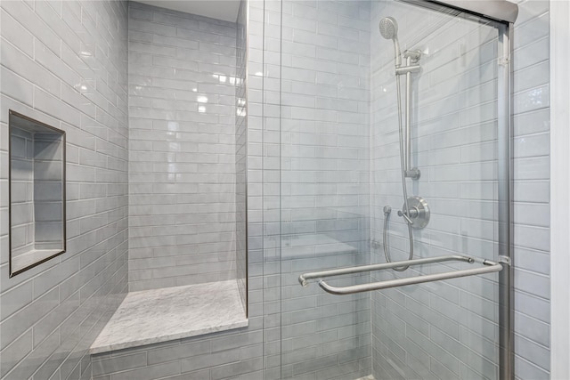 full bath featuring a shower stall