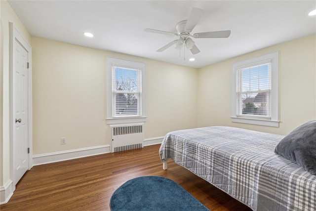 bedroom with recessed lighting, baseboards, radiator heating unit, a ceiling fan, and wood finished floors