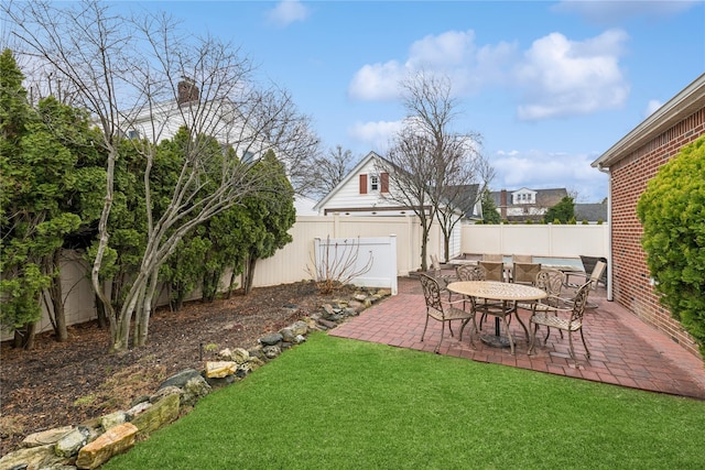 view of yard with a fenced backyard and a patio area