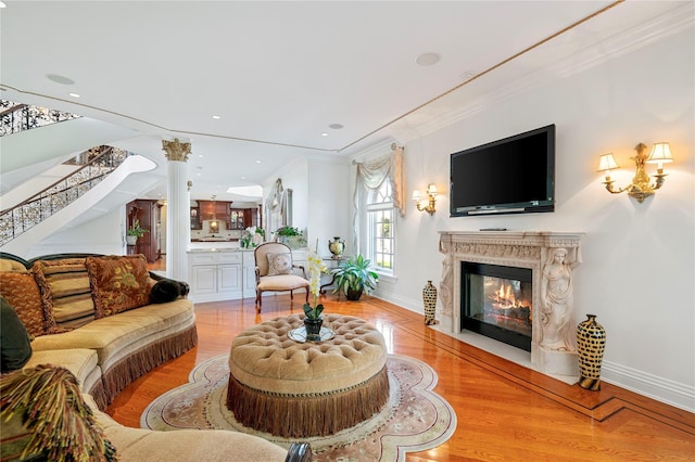 8 Tatem Way, Old Westbury, NY 11568 - living room with stairs, a high end fireplace, light wood-style floors, ornamental molding, and baseboards