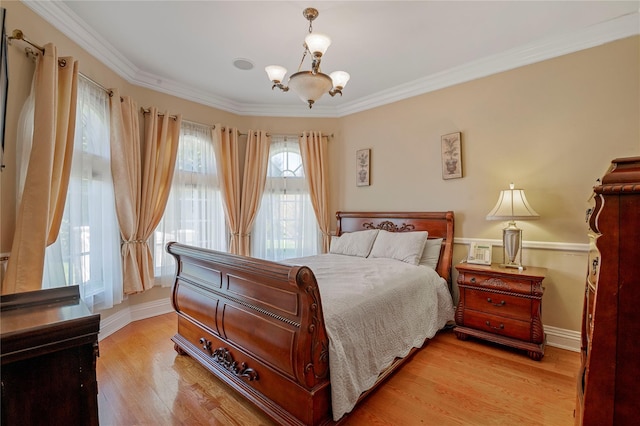 8 Tatem Way, Old Westbury, NY 11568 - bedroom with a chandelier, light wood-style flooring, ornamental molding, and baseboards