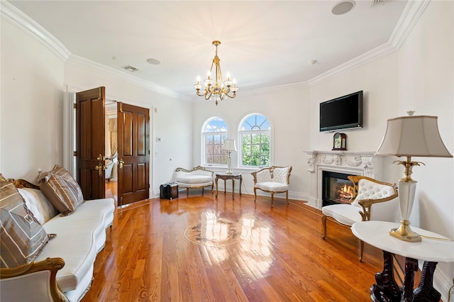 8 Tatem Way, Old Westbury, NY 11568 - sitting room with a chandelier, ornamental molding, wood finished floors, a glass covered fireplace, and baseboards