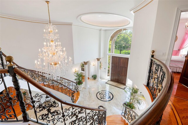 8 Tatem Way, Old Westbury, NY 11568 - entrance foyer featuring a chandelier, crown molding, and marble tiled floors