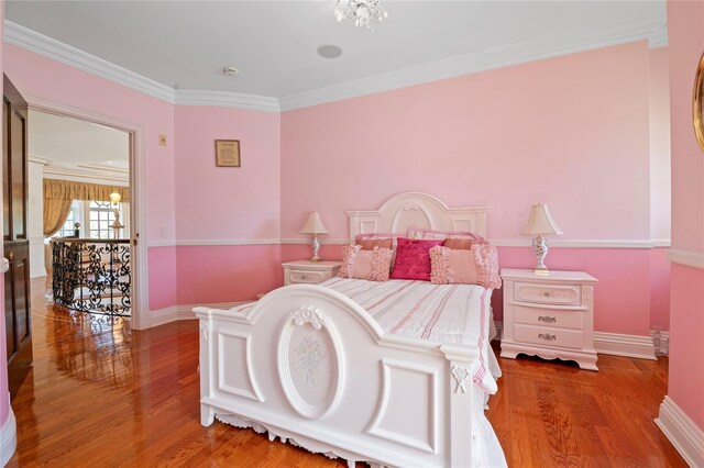 8 Tatem Way, Old Westbury, NY 11568 - bedroom featuring crown molding, wood finished floors, and baseboards