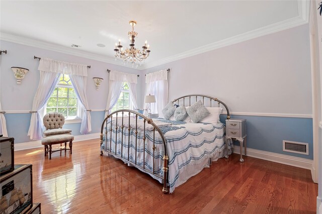 8 Tatem Way, Old Westbury, NY 11568 - bedroom with a chandelier, wood finished floors, baseboards, and ornamental molding