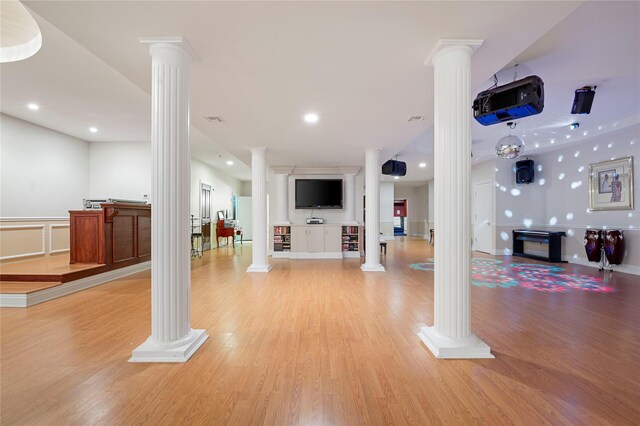 8 Tatem Way, Old Westbury, NY 11568 - living area with decorative columns, light wood-type flooring, recessed lighting, and a wainscoted wall