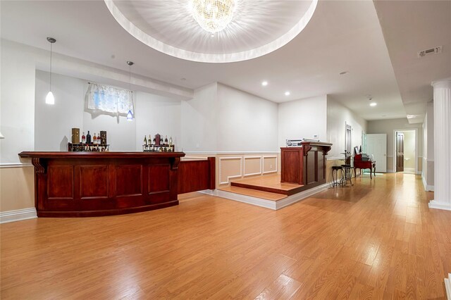 8 Tatem Way, Old Westbury, NY 11568 - indoor dry bar featuring light wood-style flooring, decorative light fixtures, recessed lighting, a chandelier, and baseboards