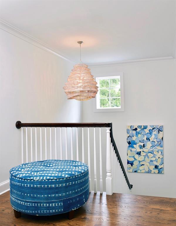 sitting room with crown molding, an upstairs landing, and wood finished floors