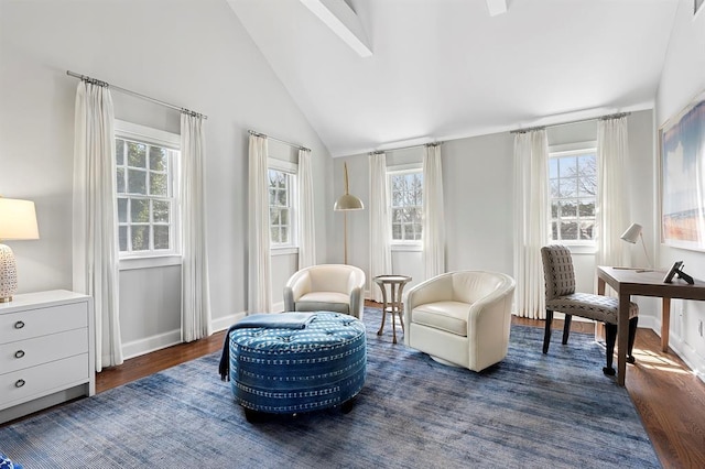sitting room featuring baseboards, plenty of natural light, vaulted ceiling, and dark wood finished floors