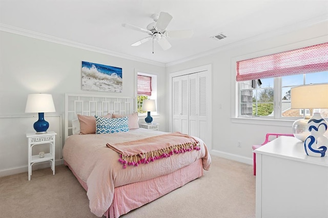 bedroom featuring crown molding, light carpet, baseboards, visible vents, and a closet