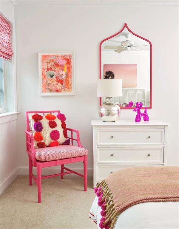 bedroom with light colored carpet and baseboards