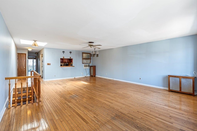 83-18 Parsons Blvd, Jamaica, NY 11431 - unfurnished living room featuring light wood-style flooring, a skylight, baseboards, and ceiling fan
