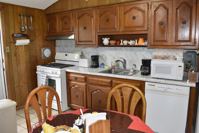 804 Commack Rd, Brentwood, NY 11717 - kitchen featuring white appliances, a sink, range hood, tasteful backsplash, and brown cabinets