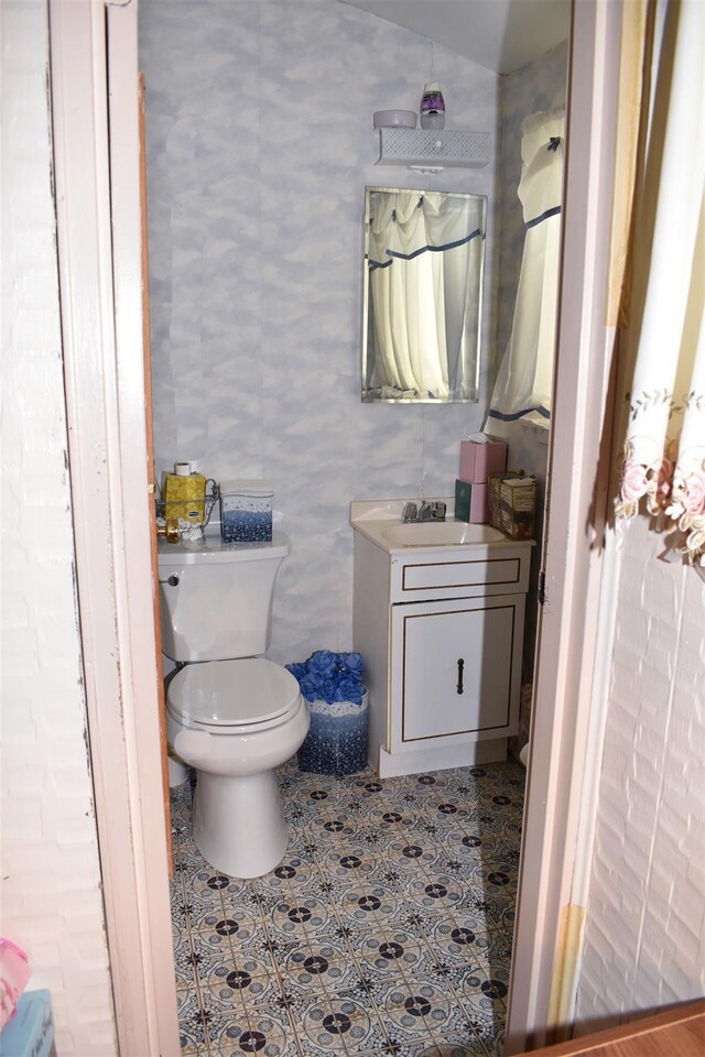 804 Commack Rd, Brentwood, NY 11717 - half bath with vanity, toilet, and tile patterned flooring