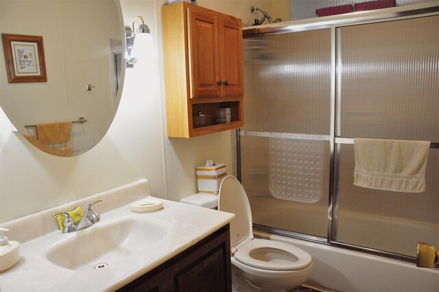 804 Commack Rd, Brentwood, NY 11717 - bathroom featuring toilet, vanity, and bath / shower combo with glass door