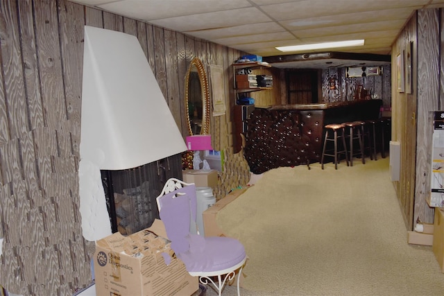 804 Commack Rd, Brentwood, NY 11717 - living room featuring carpet floors, a dry bar, wood walls, and a multi sided fireplace
