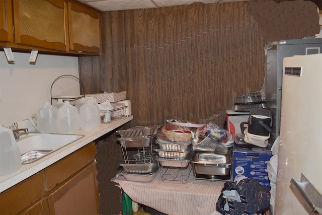 804 Commack Rd, Brentwood, NY 11717 - kitchen featuring a sink, light countertops, fridge, and brown cabinetry