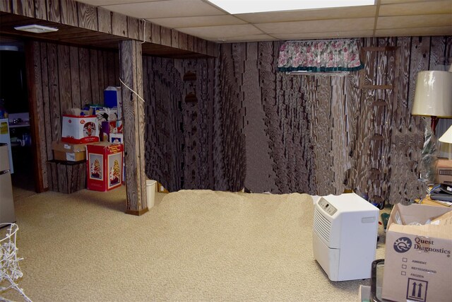 804 Commack Rd, Brentwood, NY 11717 - finished basement featuring wooden walls, a paneled ceiling, and carpet